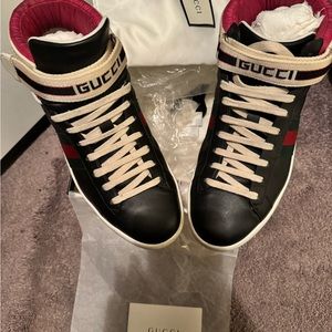 Authentic Gucci sneakers. Well loved. Scuffing around the bottom of both shoes.